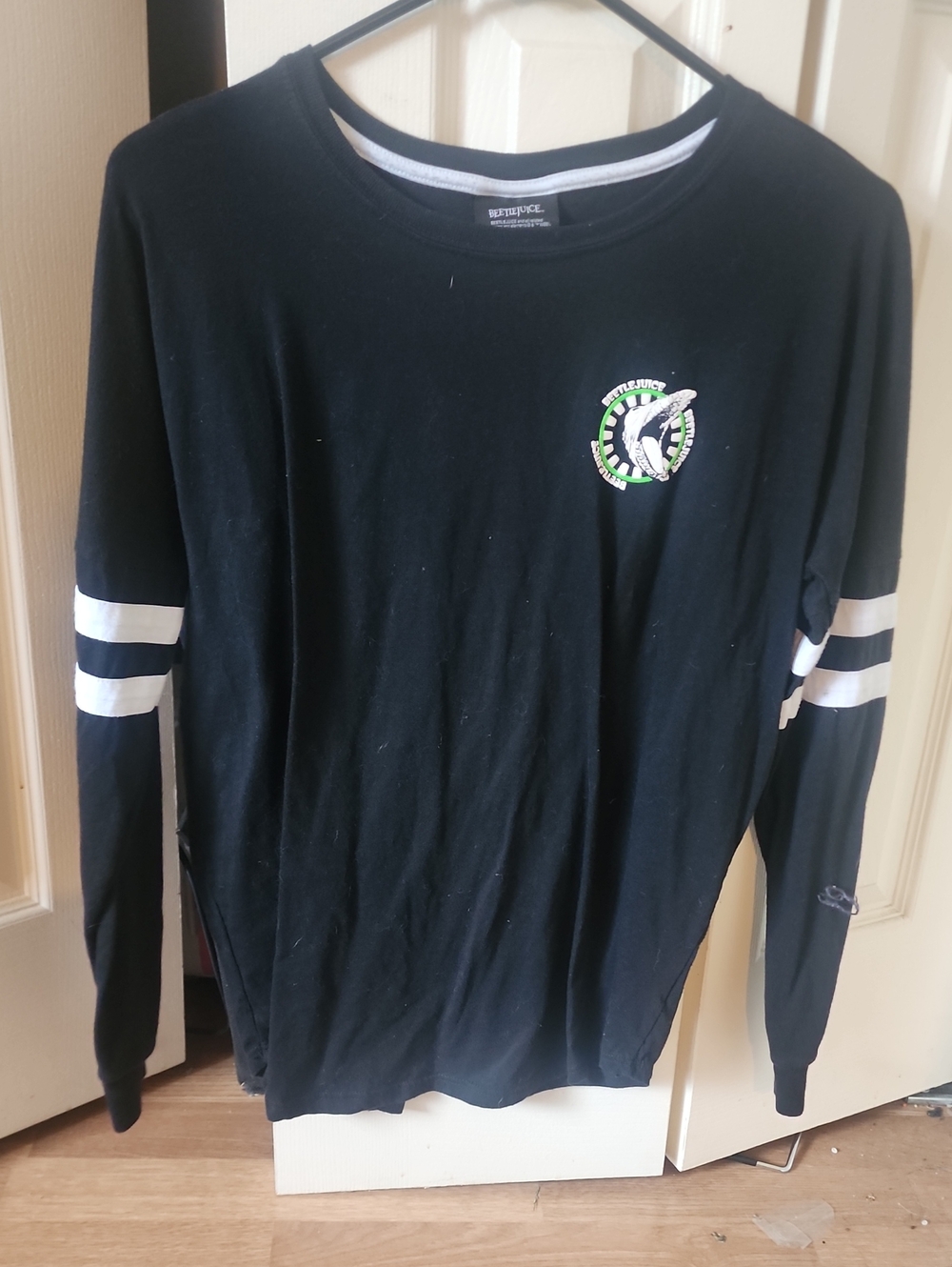 Black Long-Sleeve Beetlejuice Crewneck Sweater with White Sleeve Stripes